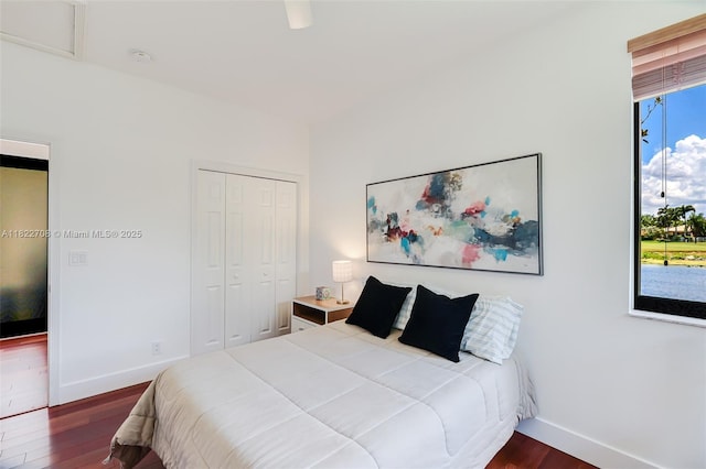2489 Eagle Watch Ln, Weston, FL 33327 - bedroom with dark wood-style flooring and a closet