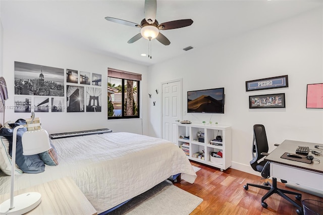 2489 Eagle Watch Ln, Weston, FL 33327 - bedroom featuring wood finished floors, an office area, and ceiling fan