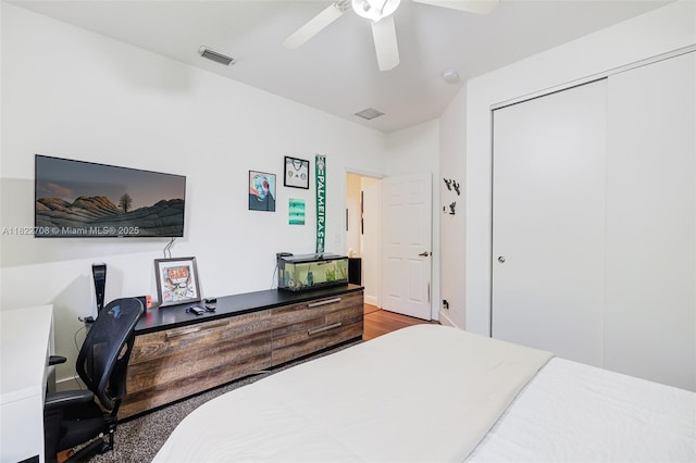 2489 Eagle Watch Ln, Weston, FL 33327 - bedroom with an office area, a closet, a ceiling fan, and wood finished floors