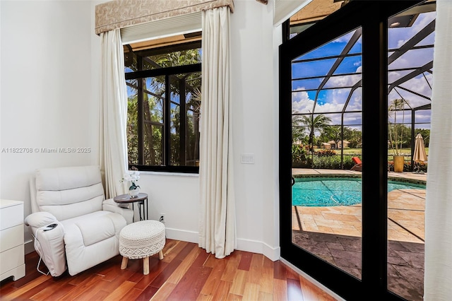 2489 Eagle Watch Ln, Weston, FL 33327 - doorway featuring wood finished floors and baseboards