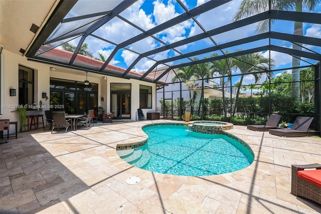 2489 Eagle Watch Ln, Weston, FL 33327 - view of swimming pool featuring a patio, a ceiling fan, a pool with connected hot tub, and glass enclosure