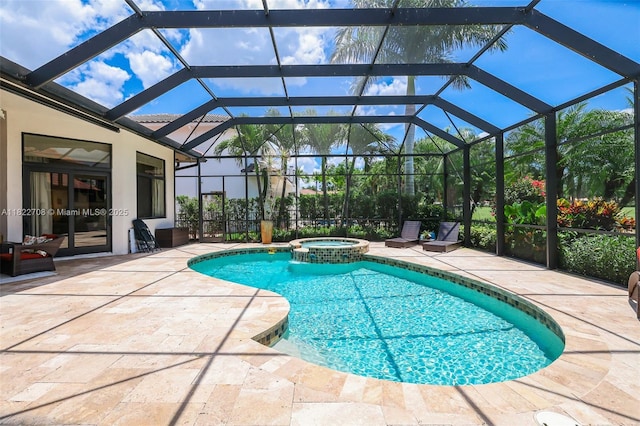 2489 Eagle Watch Ln, Weston, FL 33327 - view of swimming pool featuring a patio area, a pool with connected hot tub, and glass enclosure