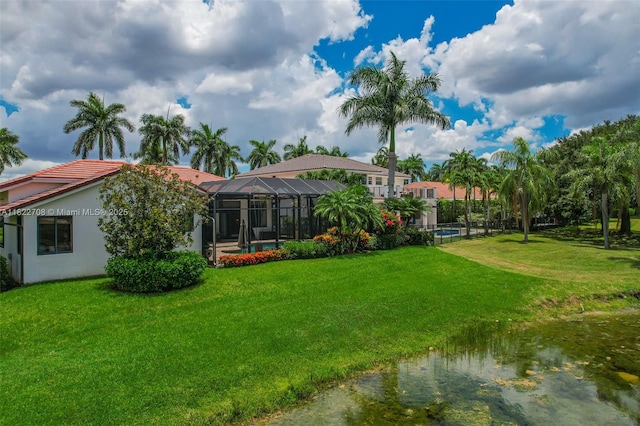 2489 Eagle Watch Ln, Weston, FL 33327 - back of property featuring a lawn, a lanai, and stucco siding