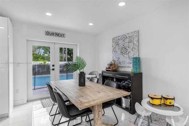 10371 SW 44th St, Miami, FL 33165 - dining space with light tile patterned floors, recessed lighting, and french doors