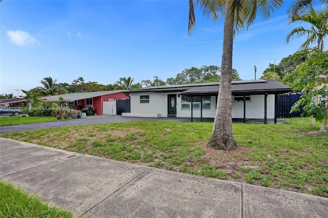 1772 SW 43rd Ave, Fort Lauderdale, FL 33317 - view of front of house featuring asphalt driveway and an attached garage