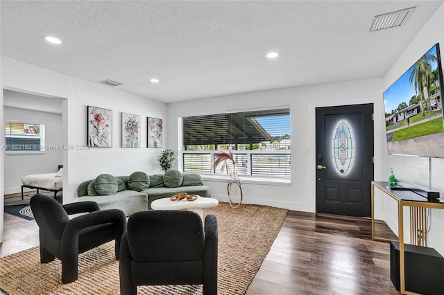 1772 SW 43rd Ave, Fort Lauderdale, FL 33317 - living area featuring wood finished floors, recessed lighting, and a textured ceiling