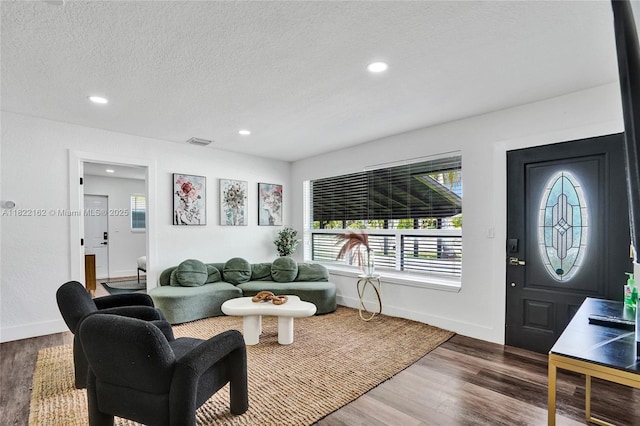1772 SW 43rd Ave, Fort Lauderdale, FL 33317 - living room with recessed lighting, dark wood-style flooring, and a textured ceiling