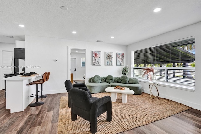 1772 SW 43rd Ave, Fort Lauderdale, FL 33317 - living area featuring dark wood-style floors, recessed lighting, and a textured ceiling