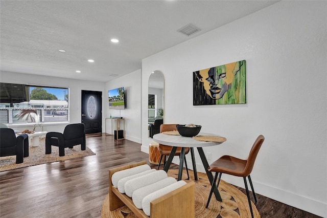 1772 SW 43rd Ave, Fort Lauderdale, FL 33317 - dining area with arched walkways, wood finished floors, and recessed lighting