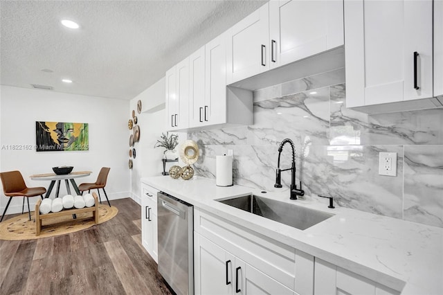 1772 SW 43rd Ave, Fort Lauderdale, FL 33317 - kitchen with stainless steel dishwasher, a textured ceiling, tasteful backsplash, white cabinets, and dark wood-style flooring