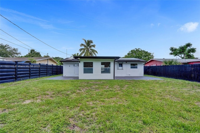 1772 SW 43rd Ave, Fort Lauderdale, FL 33317 - back of house featuring a patio, a fenced backyard, and stucco siding