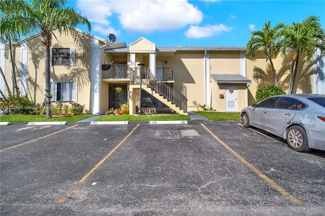 1150 N Liberty Ave Unit 1150G, Homestead, FL 33034 - view of building exterior with stairway and uncovered parking