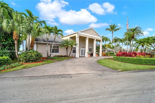 1150 N Liberty Ave Unit 1150G, Homestead, FL 33034 - view of front of home featuring french doors, stucco siding, and asphalt driveway