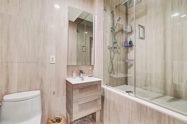 16425 Collins Ave Unit 311, Sunny Isles Beach, FL 33160 - full bathroom featuring vanity, a shower stall, and tile walls