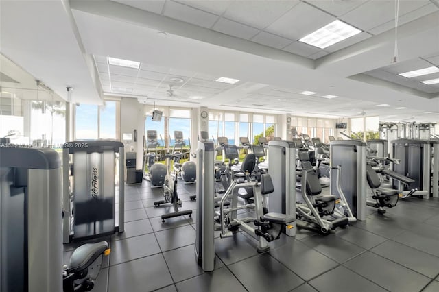 16425 Collins Ave Unit 311, Sunny Isles Beach, FL 33160 - exercise room featuring a paneled ceiling, plenty of natural light, and a wall of windows
