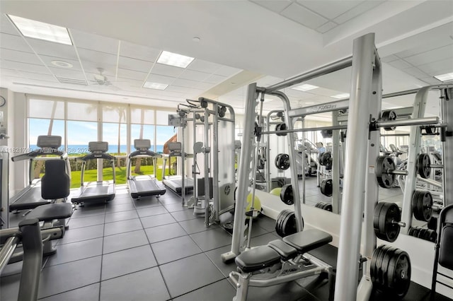 16425 Collins Ave Unit 311, Sunny Isles Beach, FL 33160 - workout area featuring a drop ceiling, a ceiling fan, and plenty of natural light