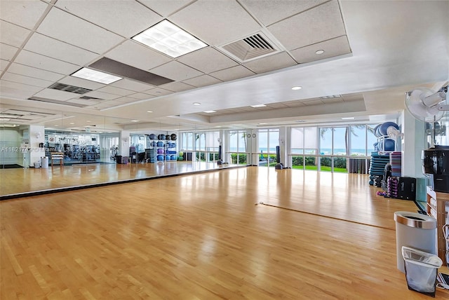 16425 Collins Ave Unit 311, Sunny Isles Beach, FL 33160 - exercise room with wood finished floors, a paneled ceiling, and a raised ceiling