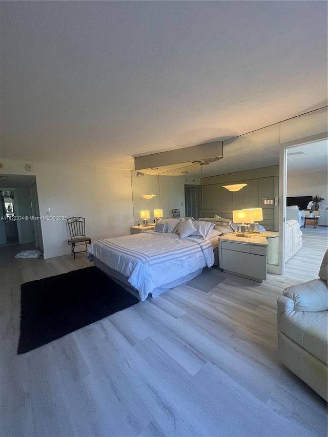 4900 N Ocean Blvd Unit 212, Lauderdale By The Sea, FL 33308 - bedroom featuring light wood-type flooring