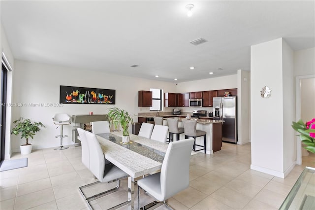 3557 W 94th Ter, Hialeah, FL 33018 - dining room with light tile patterned flooring and recessed lighting
