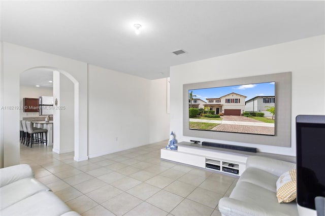 3557 W 94th Ter, Hialeah, FL 33018 - living area featuring arched walkways and light tile patterned floors