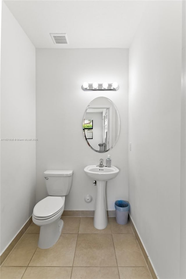 3557 W 94th Ter, Hialeah, FL 33018 - half bath featuring tile patterned floors and toilet