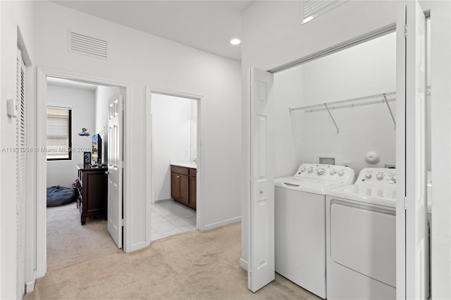 3557 W 94th Ter, Hialeah, FL 33018 - laundry area with washer and dryer, light colored carpet, and recessed lighting