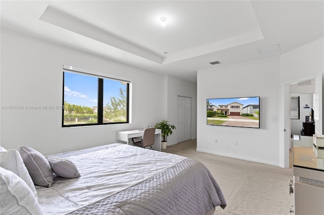3557 W 94th Ter, Hialeah, FL 33018 - bedroom featuring a tray ceiling and light colored carpet