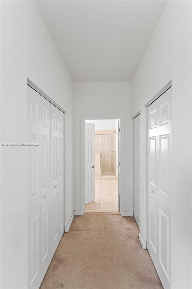 3557 W 94th Ter, Hialeah, FL 33018 - hall with light carpet and baseboards