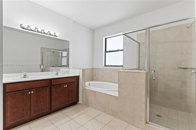 3557 W 94th Ter, Hialeah, FL 33018 - bathroom with a shower stall, a garden tub, tile patterned floors, and double vanity