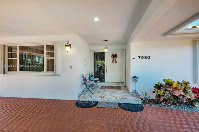 7080 SW 98th Ave, Miami, FL 33173 - property entrance with stucco siding and a porch