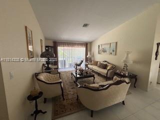 126 Chestnut Cir, Royal Palm Beach, FL 33411 - tiled living area with vaulted ceiling