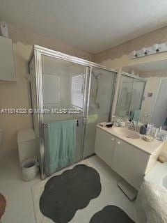126 Chestnut Cir, Royal Palm Beach, FL 33411 - full bathroom with vanity and a stall shower