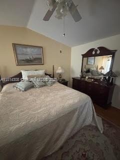 126 Chestnut Cir, Royal Palm Beach, FL 33411 - bedroom featuring vaulted ceiling and ceiling fan