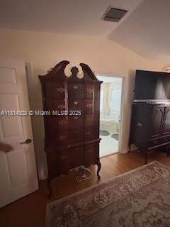 126 Chestnut Cir, Royal Palm Beach, FL 33411 - bedroom featuring lofted ceiling and wood finished floors