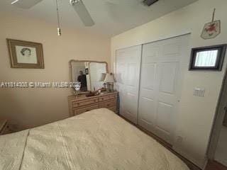 126 Chestnut Cir, Royal Palm Beach, FL 33411 - bedroom with a closet and ceiling fan