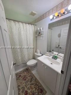 126 Chestnut Cir, Royal Palm Beach, FL 33411 - bathroom featuring vanity and toilet