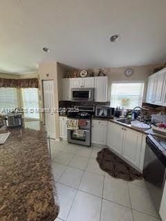 126 Chestnut Cir, Royal Palm Beach, FL 33411 - kitchen with appliances with stainless steel finishes, light tile patterned flooring, recessed lighting, white cabinets, and dark stone counters