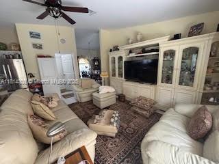 126 Chestnut Cir, Royal Palm Beach, FL 33411 - living area with a ceiling fan
