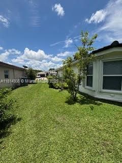 126 Chestnut Cir, Royal Palm Beach, FL 33411 - view of grassy yard