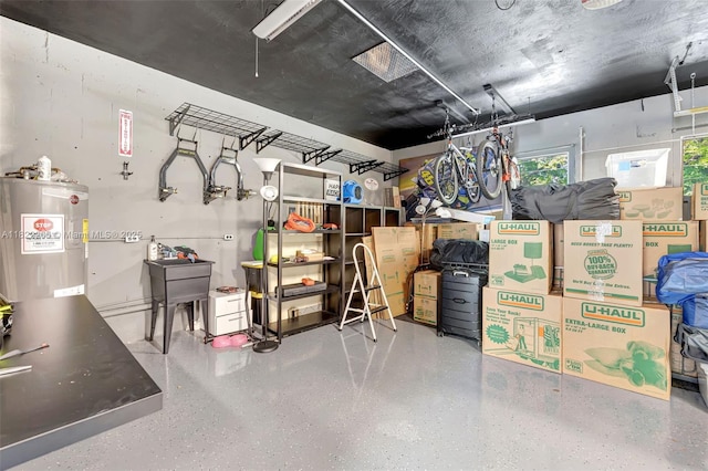 11230 SW 69th Ct, Pinecrest, FL 33156 - below grade area featuring electric water heater and a garage