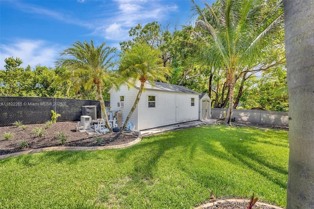 11230 SW 69th Ct, Pinecrest, FL 33156 - fenced backyard featuring a storage shed