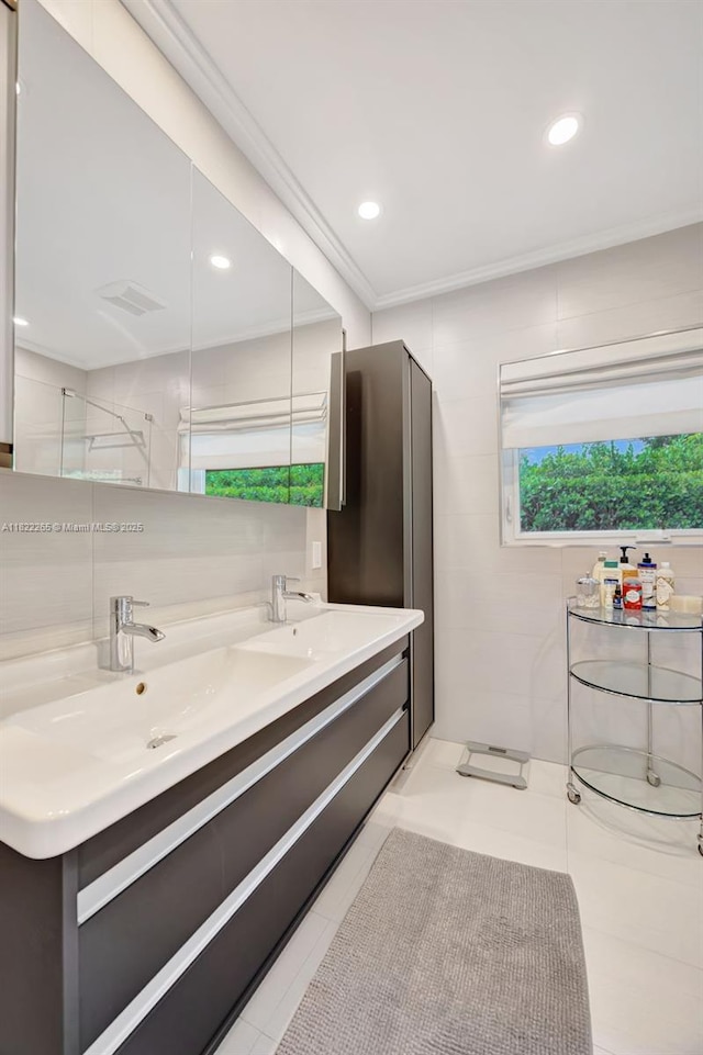 11230 SW 69th Ct, Pinecrest, FL 33156 - full bath with double vanity, ornamental molding, recessed lighting, and tile patterned flooring