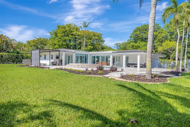 11230 SW 69th Ct, Pinecrest, FL 33156 - back of property featuring a patio