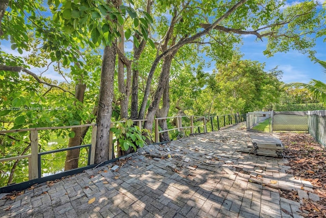 11230 SW 69th Ct, Pinecrest, FL 33156 - wooden terrace featuring a gate