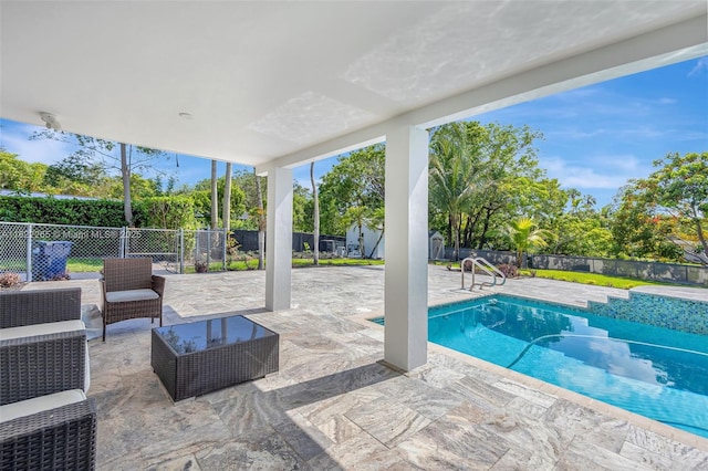 11230 SW 69th Ct, Pinecrest, FL 33156 - view of pool featuring a fenced backyard, a patio area, and a storage unit