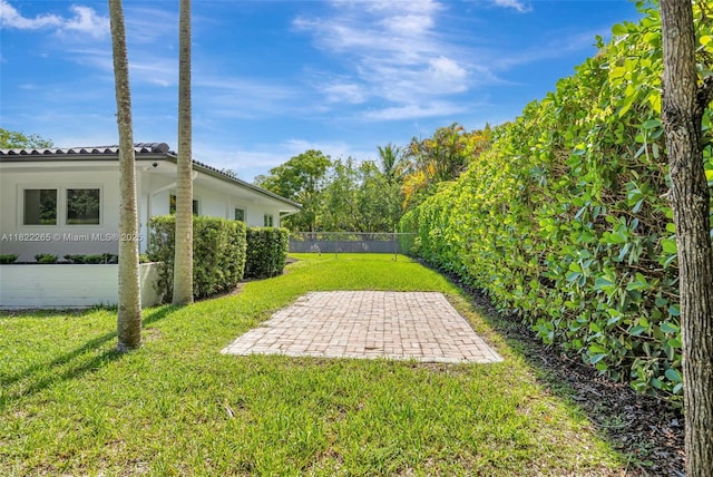 11230 SW 69th Ct, Pinecrest, FL 33156 - view of yard featuring a patio area