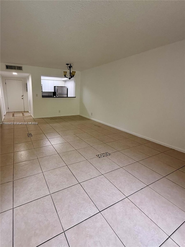 10001 W Atlantic Blvd Unit 321, Coral Springs, FL 33071 - empty room featuring light tile patterned flooring