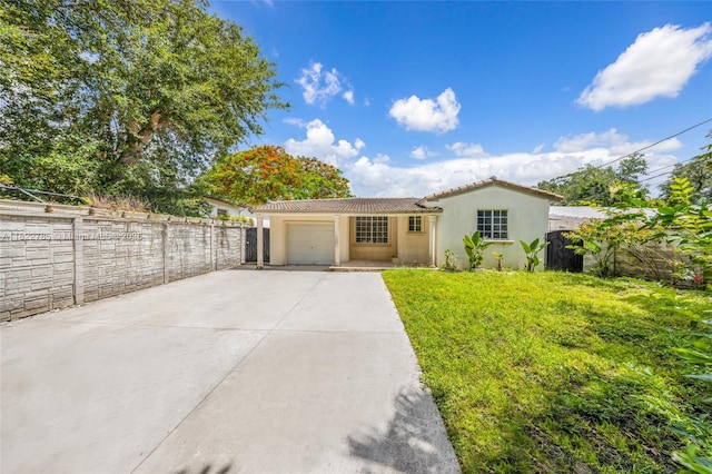 5781 SW 25th St, Miami, FL 33155 - view of front of property with stucco siding, driveway, a tile roof, and an attached garage