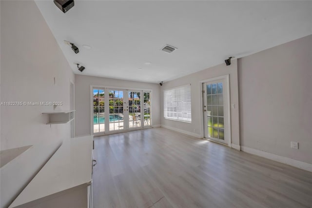 5781 SW 25th St, Miami, FL 33155 - spare room with light wood-style floors and french doors