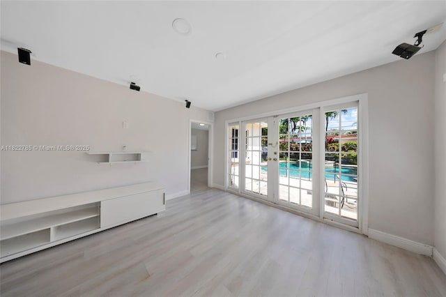5781 SW 25th St, Miami, FL 33155 - unfurnished living room featuring french doors and wood finished floors